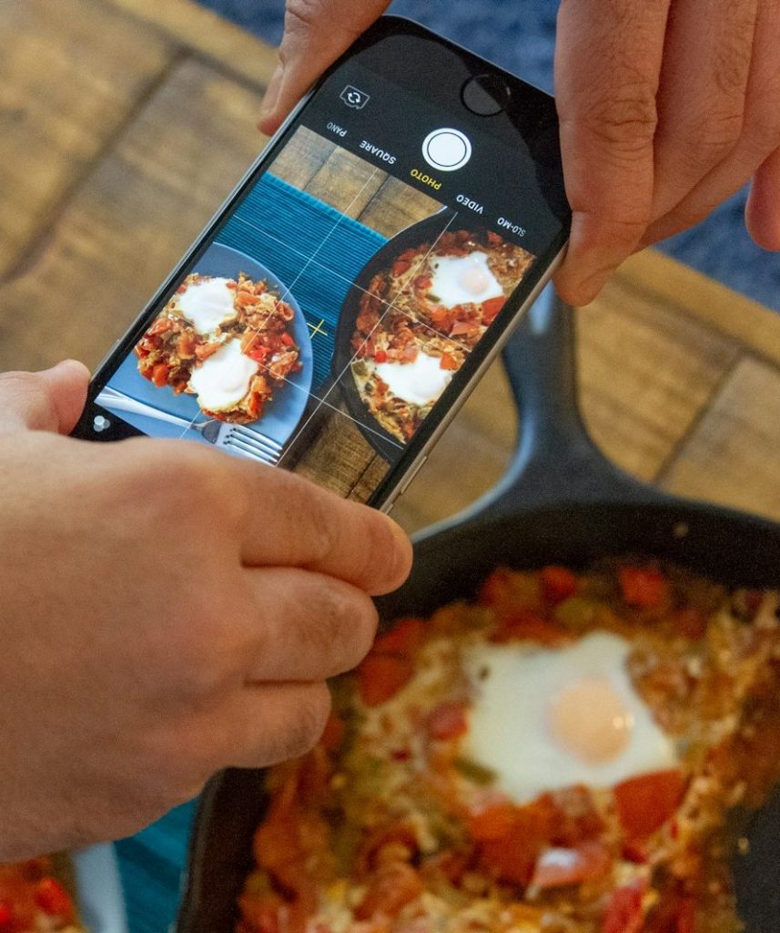 person holding space gray iPhone 6 taking photo of food